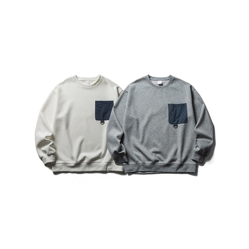 Unisex Oversize-Sweatshirt mit kontrastierender Brusttasche und D-Ring Drune