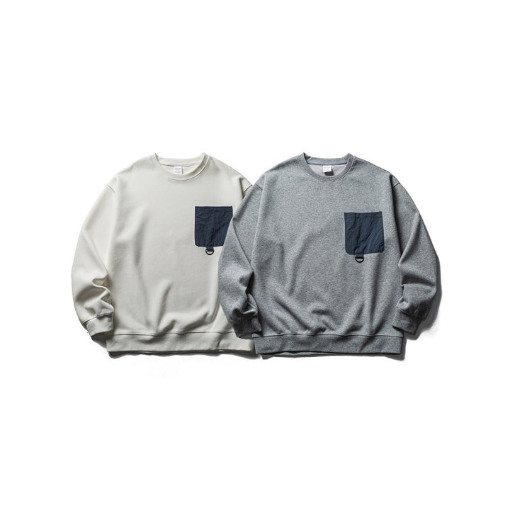 Unisex Oversize-Sweatshirt mit kontrastierender Brusttasche und D-Ring Drune