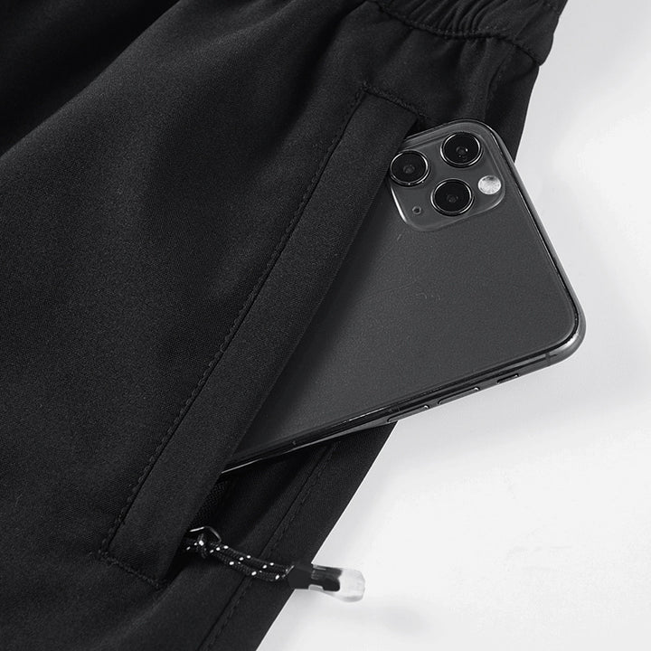 Herren Sportive tapered Jogginghose mit elastischem Bund, Reißverschlusstaschen und atmungsaktivem Funktionsmaterial Drune