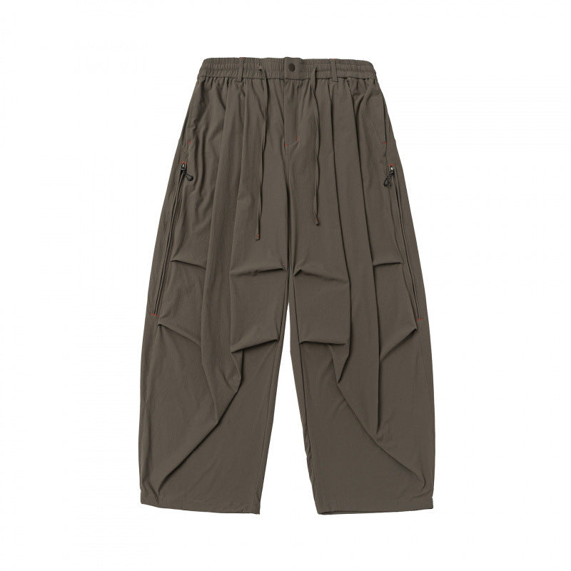 Unisex Weitgeschnittene technische Cargo-Hose mit Gummibund, Kordelzug und Reißverschlusstaschen Drune