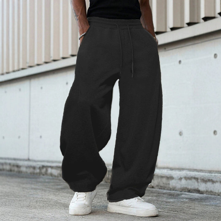 Herren weite Sweatpants im Baggy Cut mit elastischem Bund, Tunnelzug und Eingrifftaschen Drune