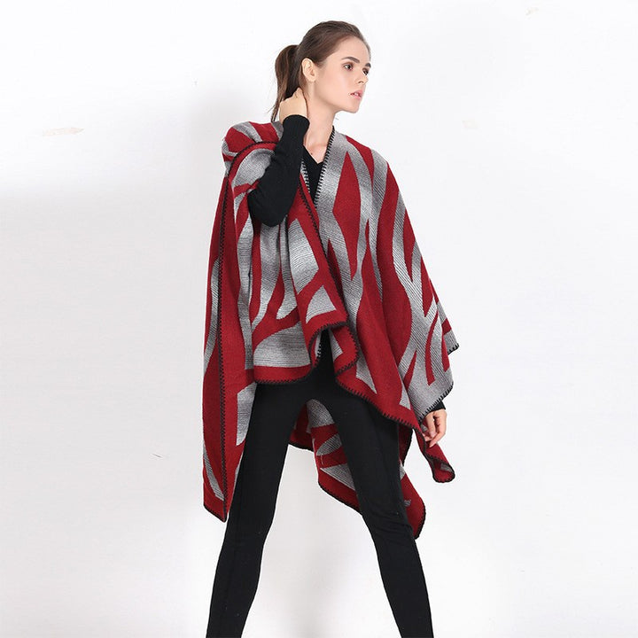 Damen Oversize-Strickcape mit abstrakter Wellenjacquard‑Struktur und kontrastierter Kettelkante Drune