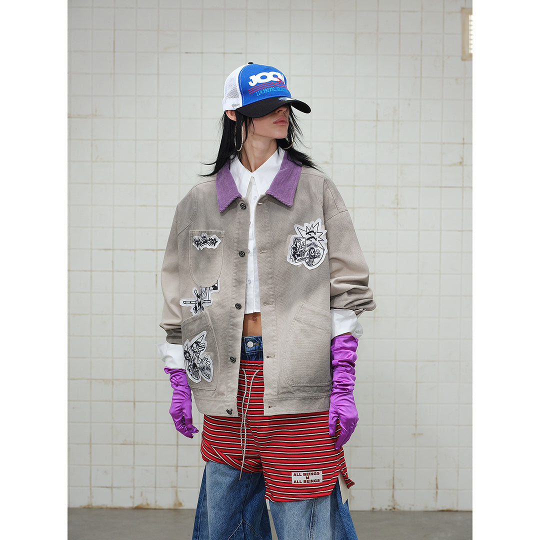 Unisex Kastig geschnittene Chorejacke aus Baumwollcanvas mit artistischen Patch Applikationen und Cordkragen Drune