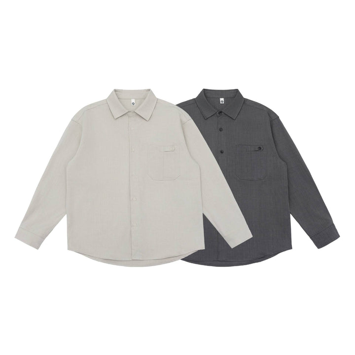 Unisex Oversize Hemdjacke im minimalistischen Workwear Stil mit gerundetem Saum und Brustpattentasche Drune