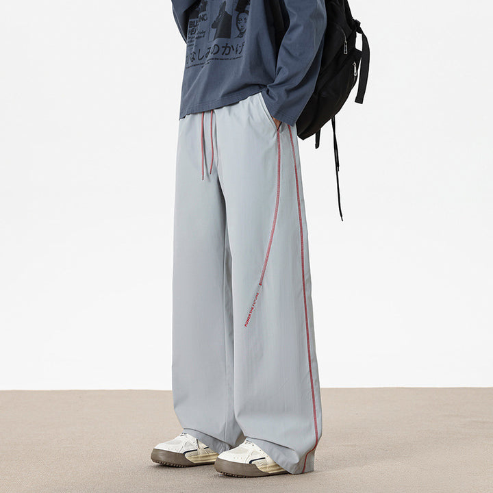 Herren Weitgeschnittene Sporthose mit reflektierenden Details