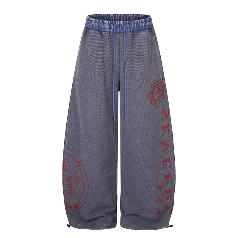 Damen Weite Mid‑Calf Palazzo‑Sweathose mit verstellbarem Saum, Tunnelzugbund und Statement‑Print Drune