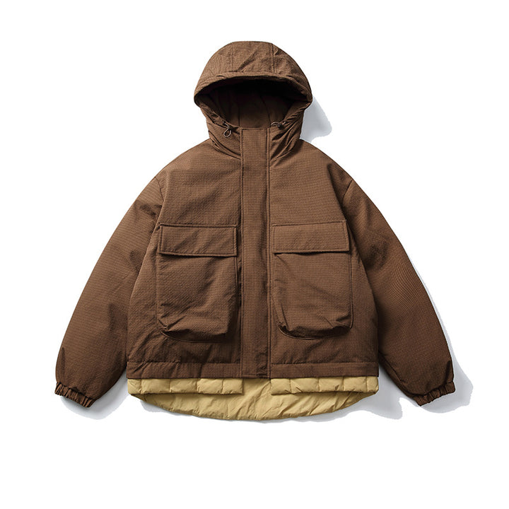 Unisex Kurz geschnittene wattierte Kapuzenjacke im Materialmix mit aufgesetzten Taschen Drune