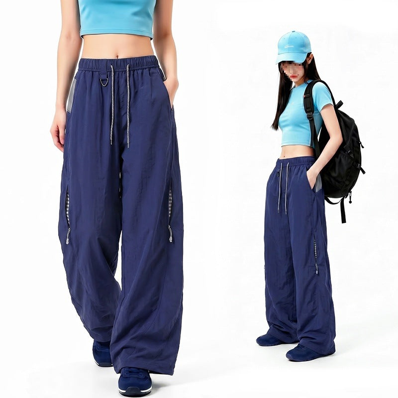 Damen Oversize Tech-Loungehose mit Kontrastnähten, reflektierenden Reißverschlusstaschen & Kordelbund Drune
