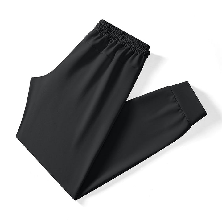 Herren athletische Tech-Jogginghose mit elastischem Kordelbund, verdeckten Reißverschlusstaschen und formgebenden Knöchelbündchen Drune