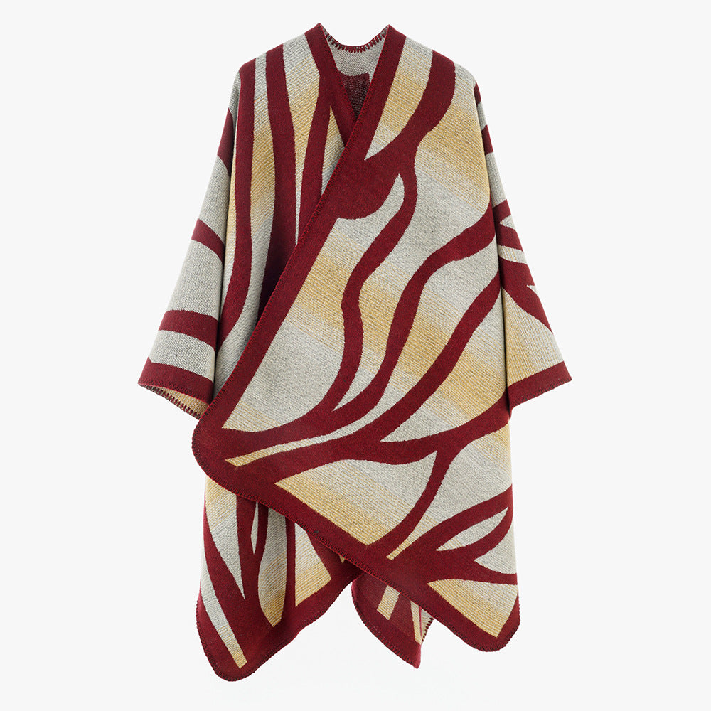 Damen Oversize-Strickcape mit abstrakter Wellenjacquard‑Struktur und kontrastierter Kettelkante Drune