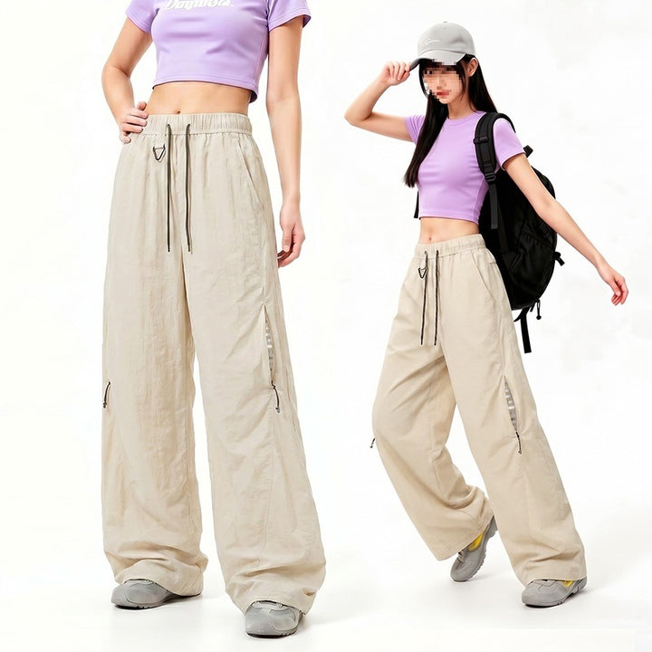Damen Oversize Tech-Loungehose mit Kontrastnähten, reflektierenden Reißverschlusstaschen & Kordelbund Drune