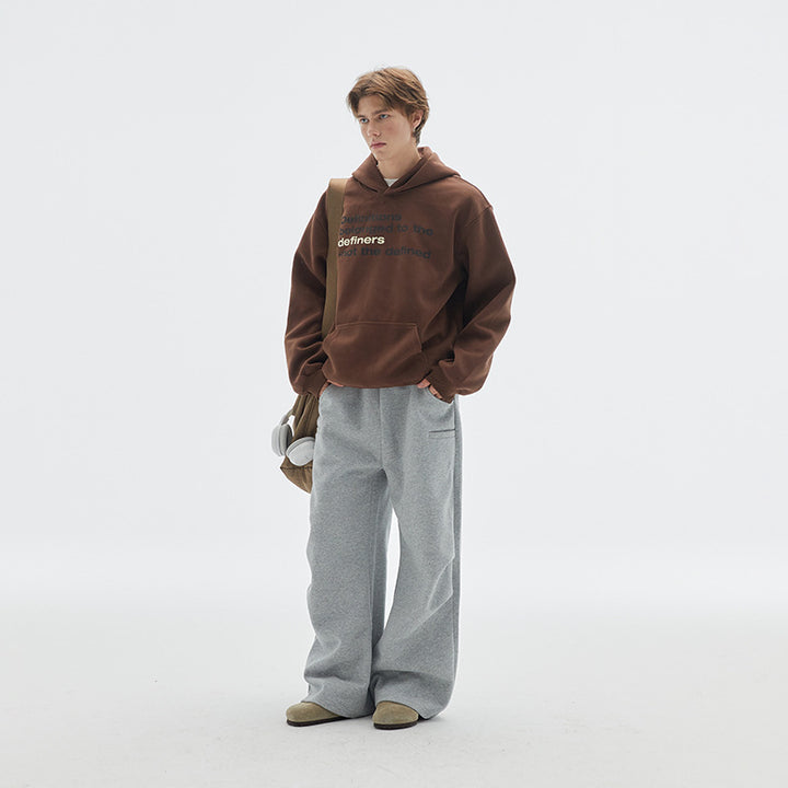 Unisex Oversize-Kapuzenpullover aus Baumwollmix mit Kängurutasche und Statement-Print Drune