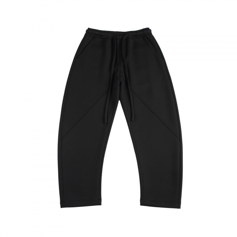 Unisex Weite Tech-Jogginghose mit diagonalem Nahtdesign, Elastikbund und Tunnelzug Drune