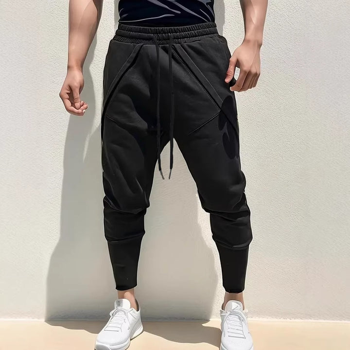 Herren Tapered-Jogginghose mit tiefem Schritt, elastischem Bund & diagonalgesetzten Taschen Drune