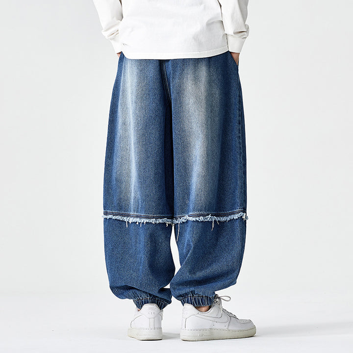 Herren Weit geschnittene Baggy-Denim-Hose mit Tunnelzug, elastischen Beinabschlüssen und Fransen-Detail Drune
