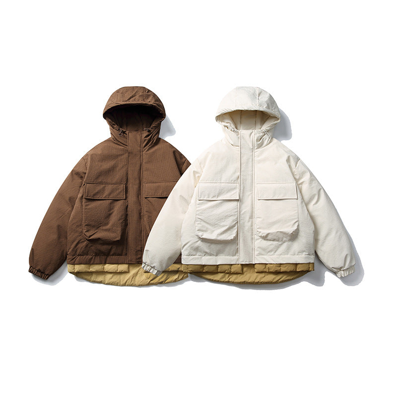 Unisex Kurz geschnittene wattierte Kapuzenjacke im Materialmix mit aufgesetzten Taschen Drune