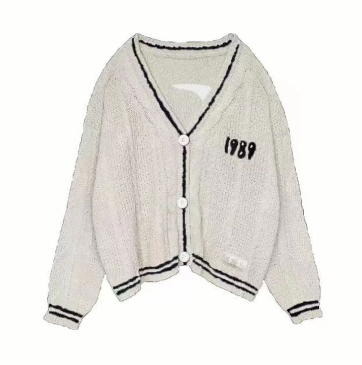 Damen nan kurz geschnittene Strickjacke mit V-Ausschnitt, Kontrastpaspel und oversized Ärmeln Drune