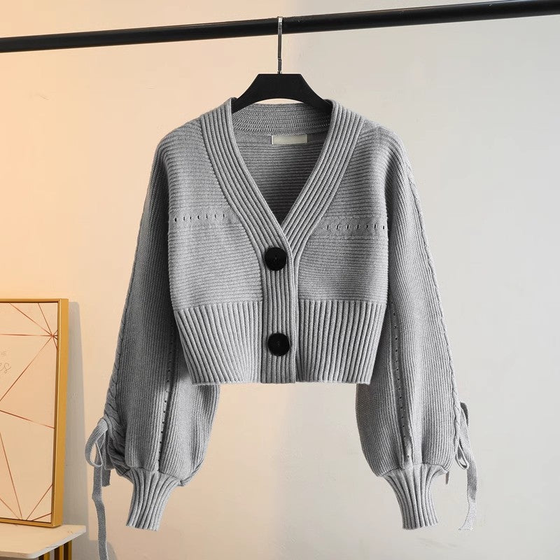 Damen modische Strickjacke mit voluminösen Ärmeln und Knopfdetails Drune