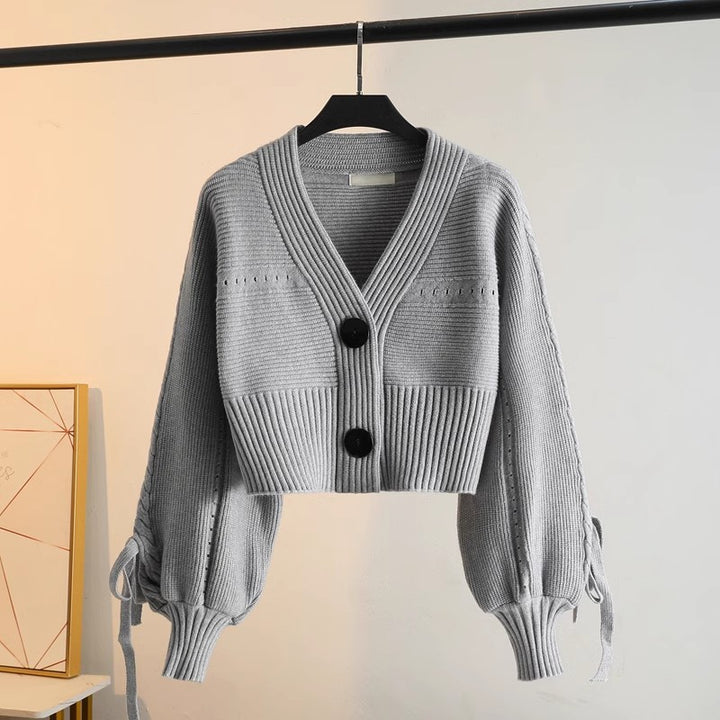 Damen modische Strickjacke mit voluminösen Ärmeln und Knopfdetails Drune