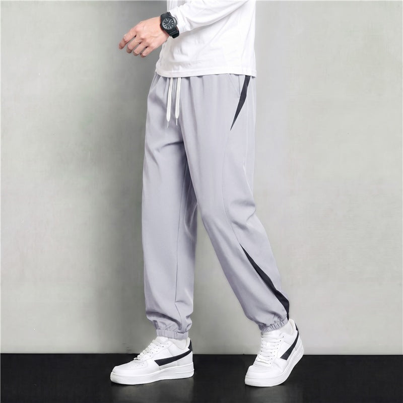 Herren Athleisure Jogginghose im Baggy‑Schnitt mit elastischem Bund, Tunnelzug und seitlichen Kontrastkeilen Drune