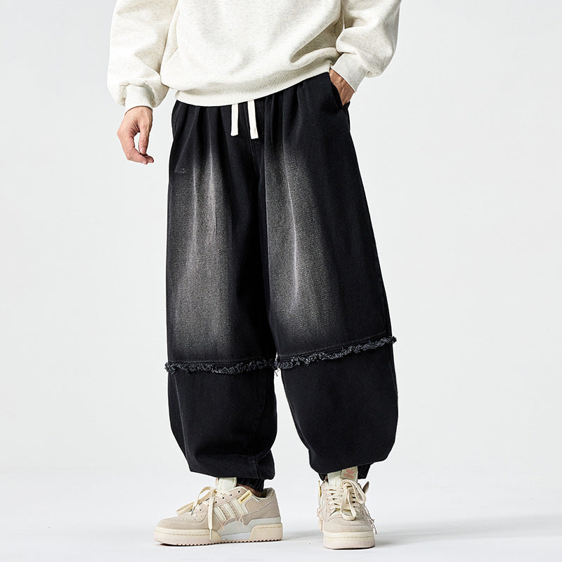 Herren Weit geschnittene Baggy-Denim-Hose mit Tunnelzug, elastischen Beinabschlüssen und Fransen-Detail Drune