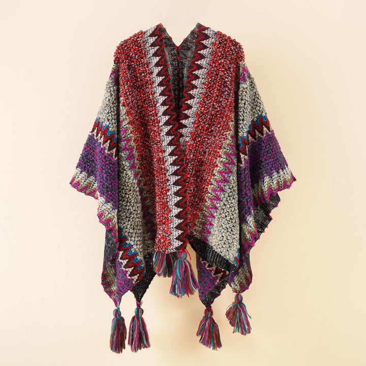 Damen strukturierter Bouclé-Strickponcho mit Jacquardmuster und Quasten Drune