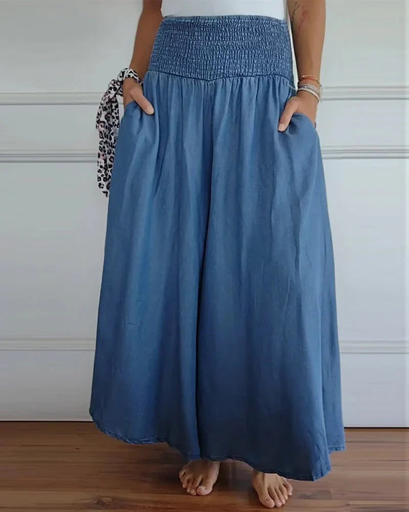 Damen-Maxi-Rock mit hohem Smockbund, weitem Fall und seitlichen Taschen Drune