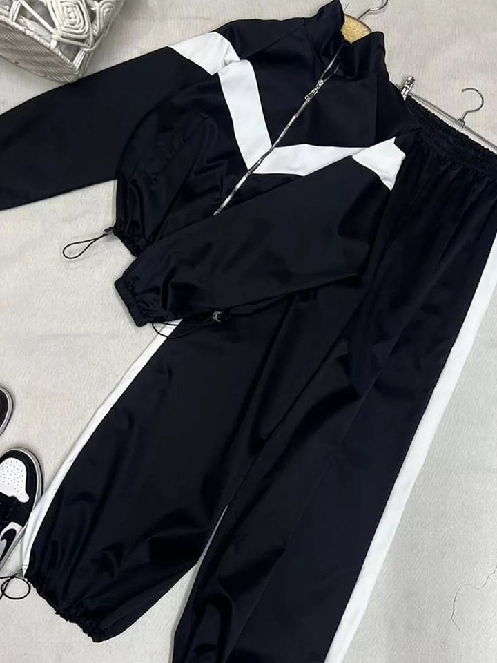 Damen tailliertes Zip-Trainingsset mit Chevron-Einsatz, Kordelzugsaum und hochgeschnittener Jogginghose Drune