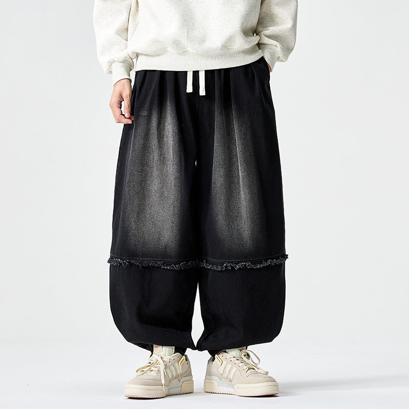 Herren Weit geschnittene Baggy-Denim-Hose mit Tunnelzug, elastischen Beinabschlüssen und Fransen-Detail Drune