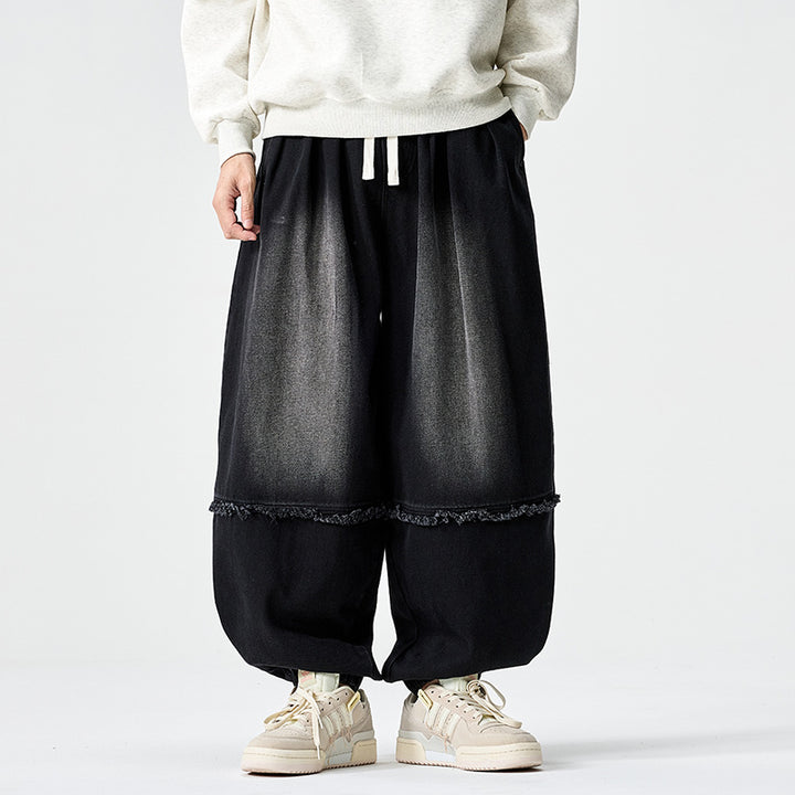 Herren Weit geschnittene Baggy-Denim-Hose mit Tunnelzug, elastischen Beinabschlüssen und Fransen-Detail Drune