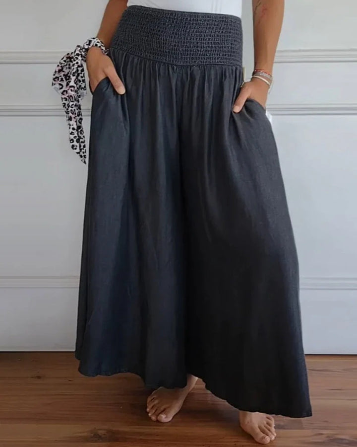 Damen-Maxi-Rock mit hohem Smockbund, weitem Fall und seitlichen Taschen Drune