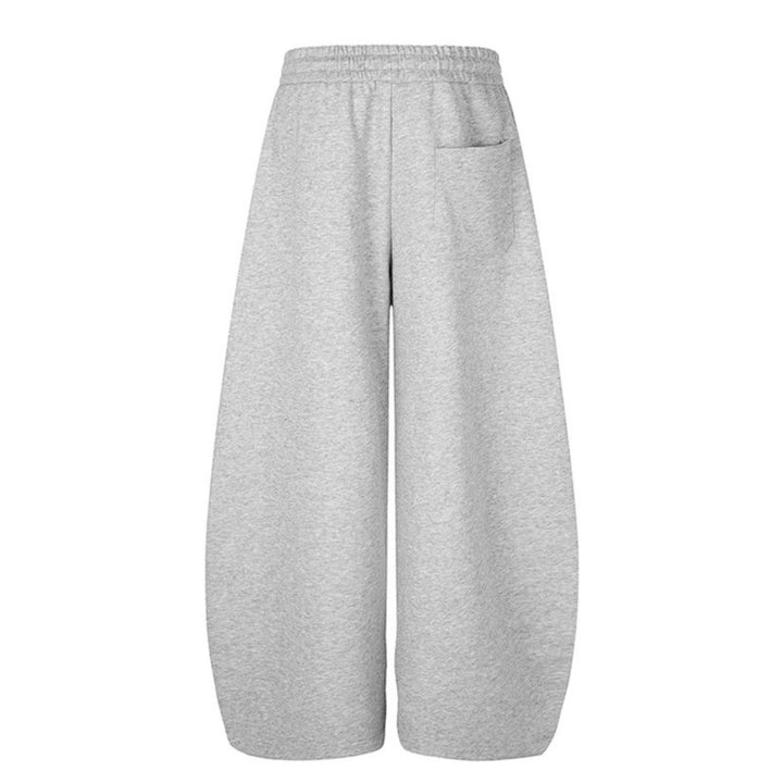 Damen Weite Midilounge‑Sweathose im Palazzo‑Cut mit Tunnelzug, Zip‑Saum und Statement‑Print Drune