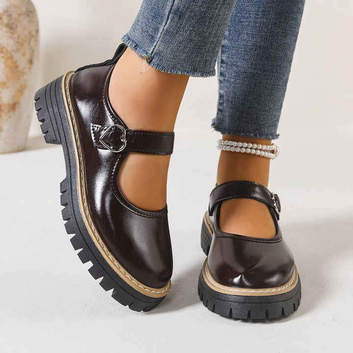 Damen Riemchen‑Slipper im Mary‑Jane‑Stil mit grober Profilsohle und Herzschließe Drune