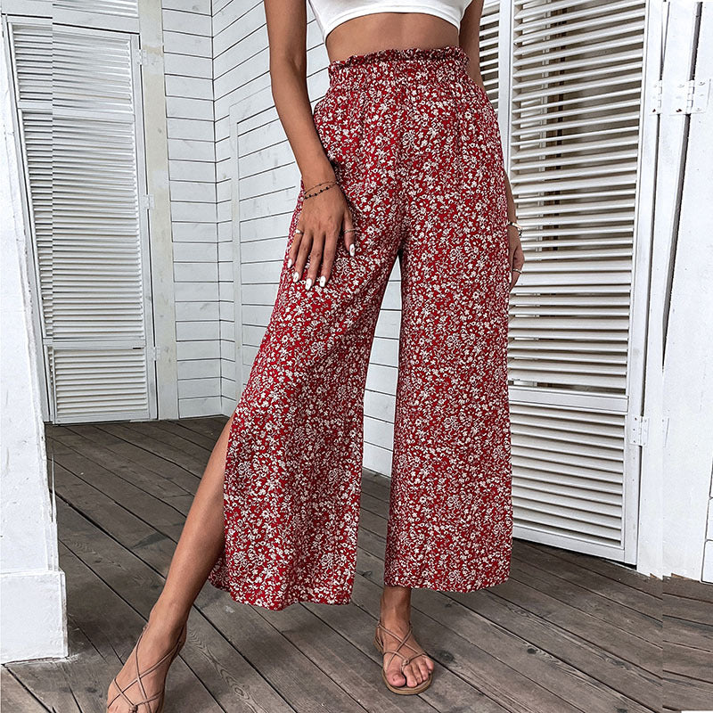 Damen Weite hochgeschnittene Palazzo‑Hose mit floralem Muster und seitlichem Beinschlitz Drune
