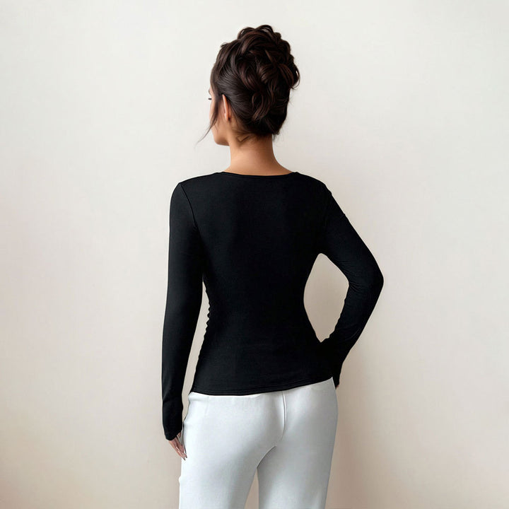 Damen figurbetontes Langarmshirt mit asymmetrischem Ausschnitt und dekorativer Brosche Drune