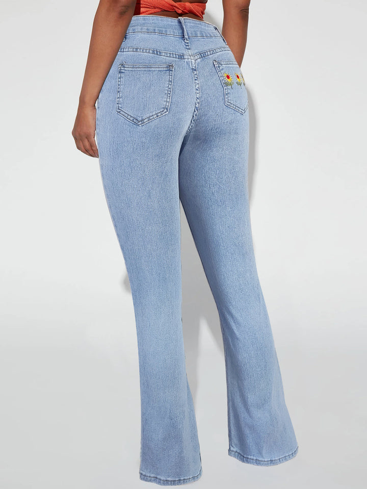 Damen Taillenhohe Schlagjeans mit Gänseblümchen-Stickerei und formendem Schnitt Drune