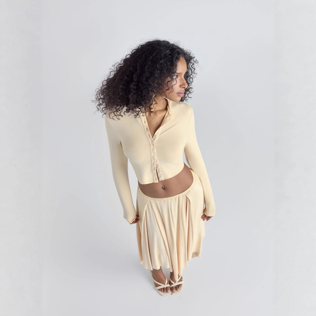 Damen Cropped-Cardigan mit Perlmuttknöpfen und asymmetrischem Zipfel-Midirock Drune