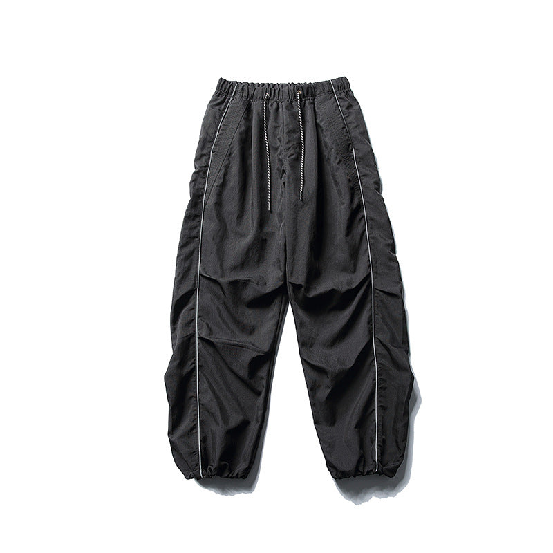 [Herren] weit geschnittene Nylon-Joggerhose im Utility-Stil mit Tunnelzugbund, Kontrastpaspel und elastischen Knöchelabschlüssen Drune