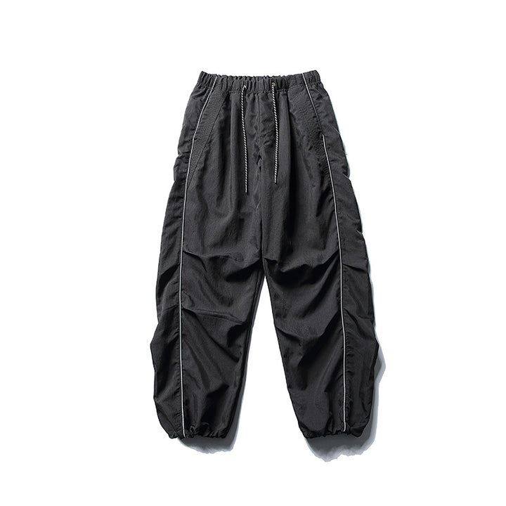 [Herren] weit geschnittene Nylon-Joggerhose im Utility-Stil mit Tunnelzugbund, Kontrastpaspel und elastischen Knöchelabschlüssen Drune