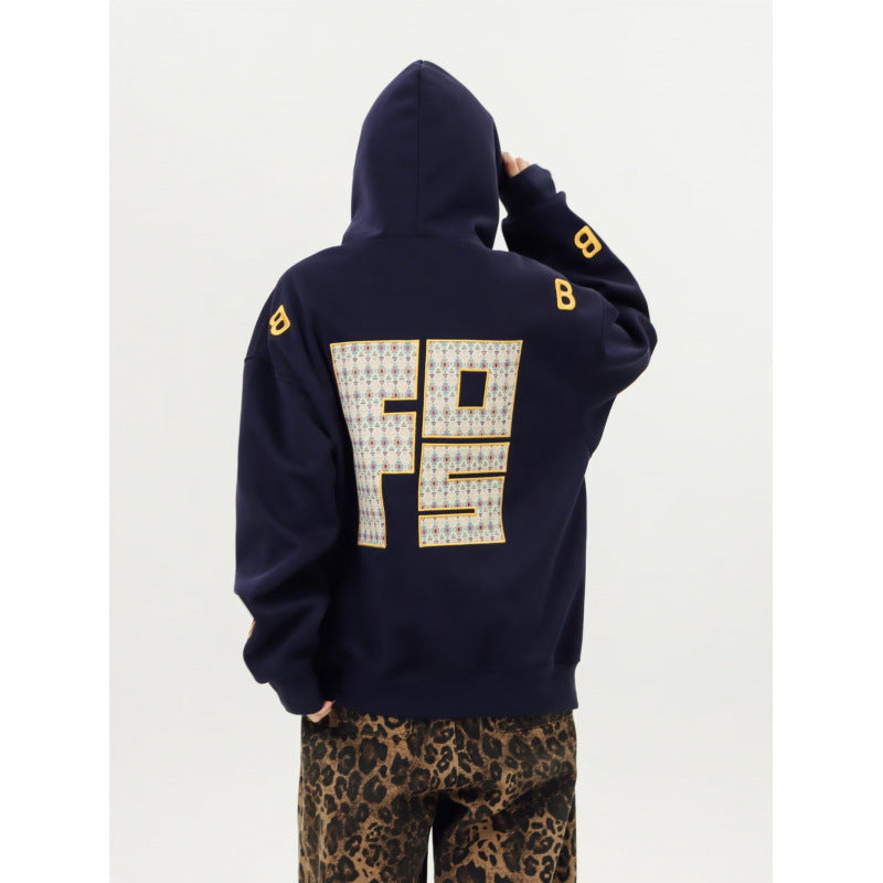 Unisex Oversized Kapuzenpullover mit großflächigem Intarsien‑Blockprint und geripptem Saum Drune