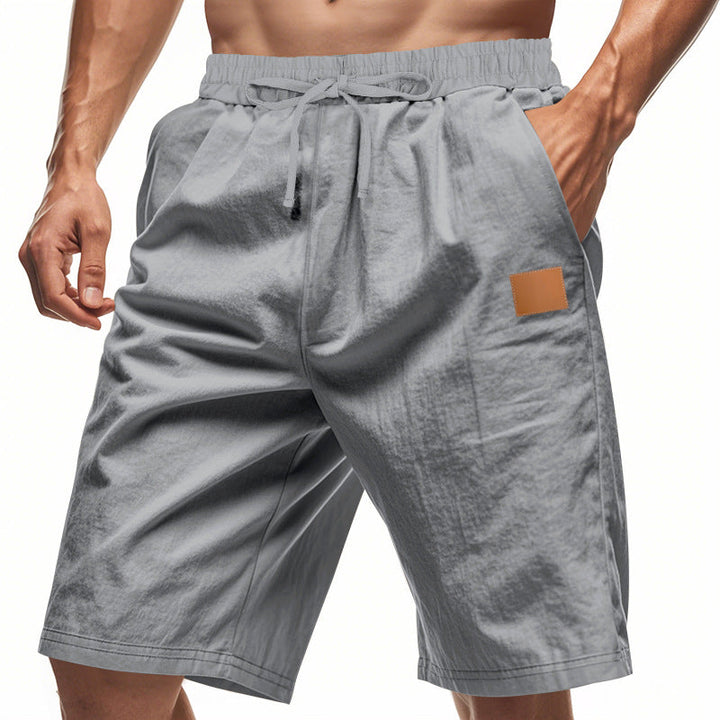 Herren nan leichte Freizeit-Bermudashorts mit Elastikbund, Kordelzug und dezenter Lederapplikation Drune