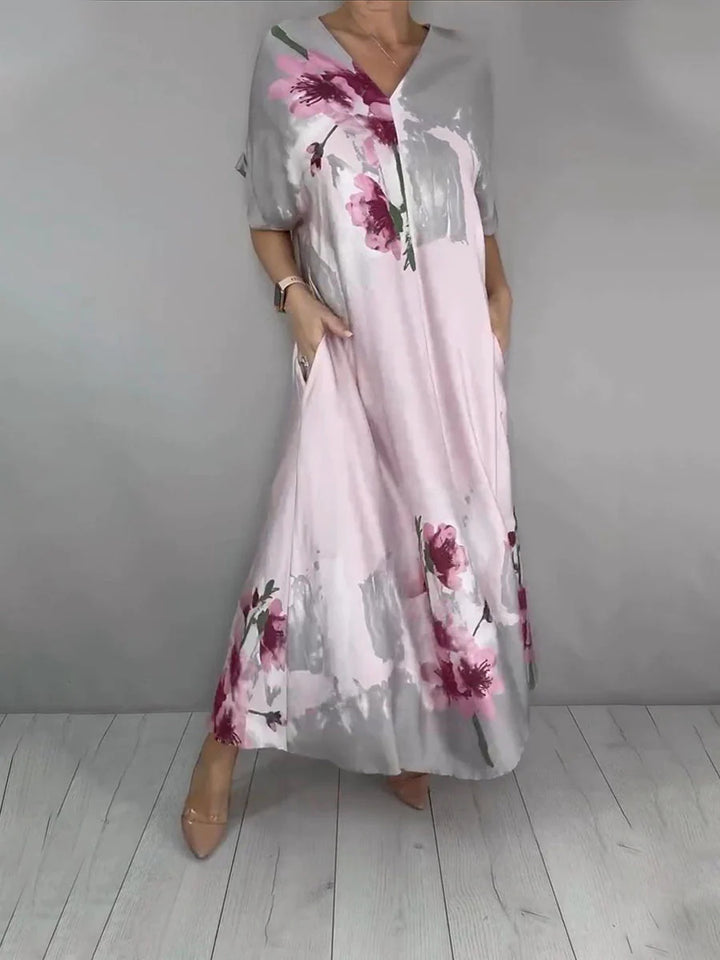 Damen Maxikleid mit weitem Fall, V-Ausschnitt, Eingrifftaschen und floraler Aquarelloptik Drune