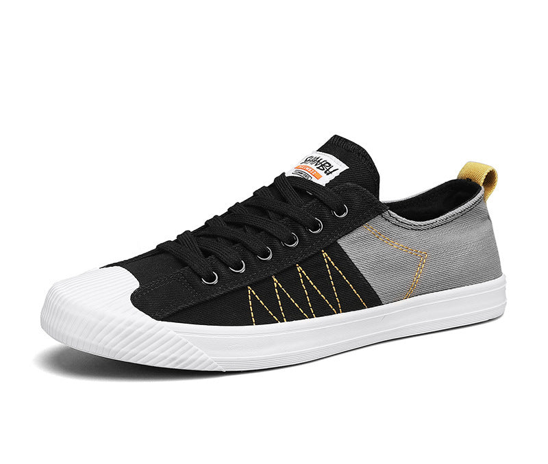 Unisex niedrige Canvas-Sneaker mit verstärkter Gummi-Zehenkappe und kontrastierenden Textilpaneelen Drune