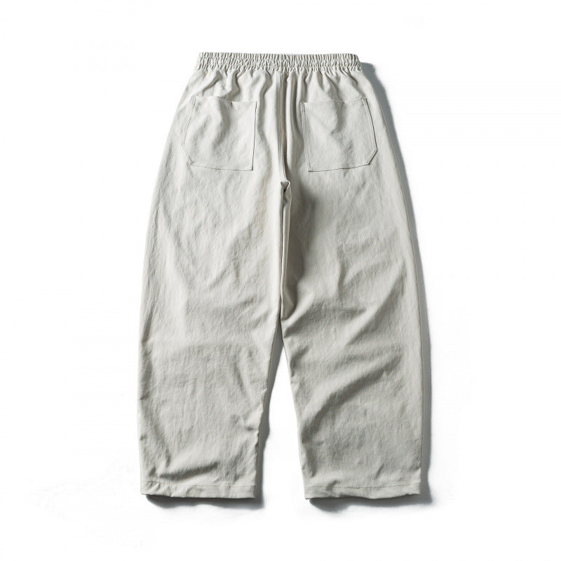 Unisex Weite Cropped-Hose mit Tunnelzug, elastischem Bund und markanten Nahtpaneelen Drune