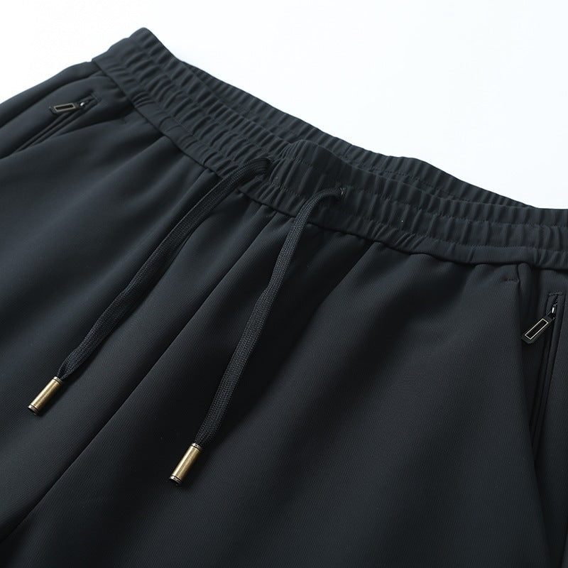 Herren Slim-Tapered Performance-Jogginghose aus wasserabweisendem Funktionsstoff mit elastischem Kordelbund & verdeckten Reißverschlusstaschen Drune