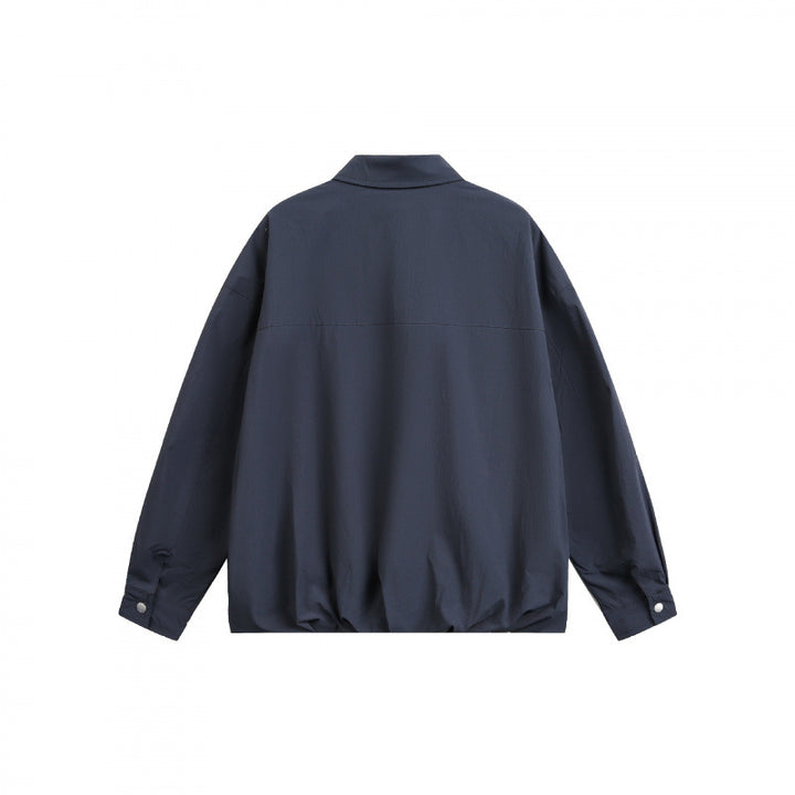 Unisex Boxy-Hemdjacke mit Druckknopfleiste, Hemdkragen und elastischem Saum Drune