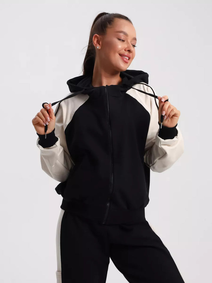 Damen sportlicher Kapuzen-Trainingsanzug aus Baumwollmix mit durchgehendem Reißverschluss und Kontrastärmeln Drune