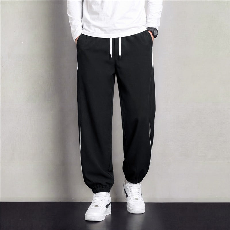 Herren Athleisure Jogginghose im Baggy‑Schnitt mit elastischem Bund, Tunnelzug und seitlichen Kontrastkeilen Drune