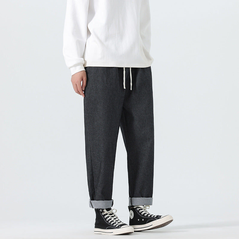 Herren Locker geschnittene Cropped-Denimhose mit Umschlag und Label-Patch Drune