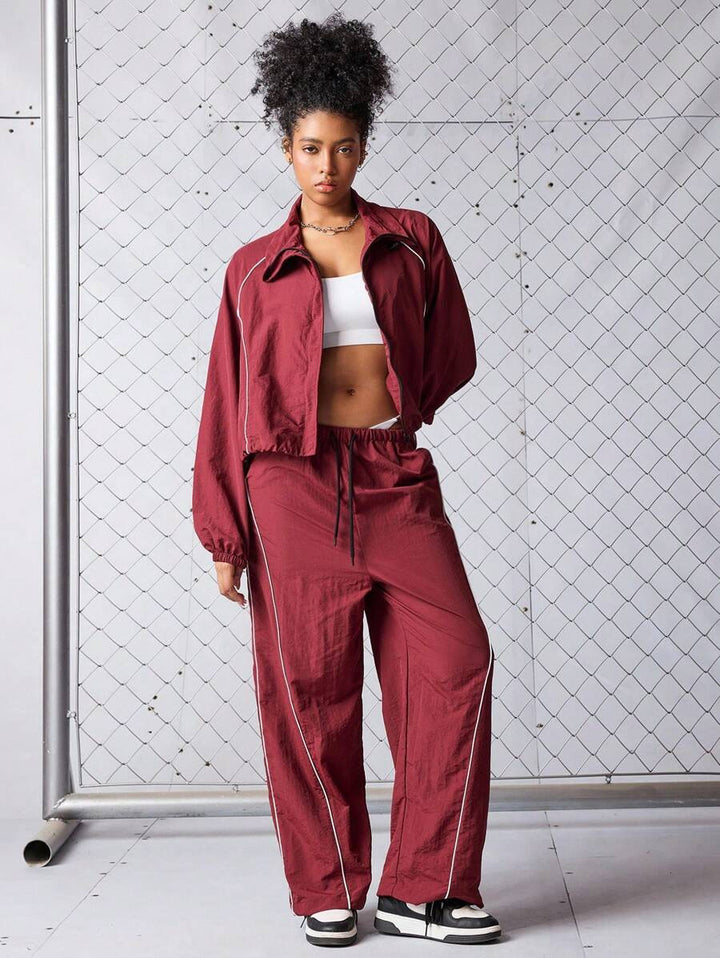 Damen sportives Cropped Windbreaker-Set mit Stehkragen Tunnelzug und reflektierenden Paspeln Drune